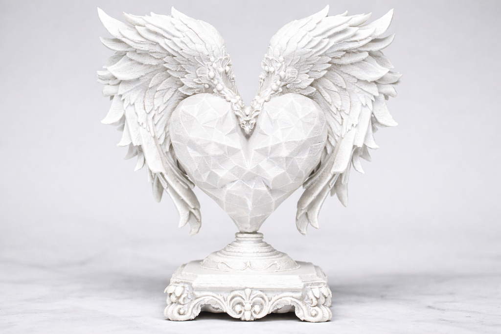 Statuetta decorativa - Emblema dal cuore alato